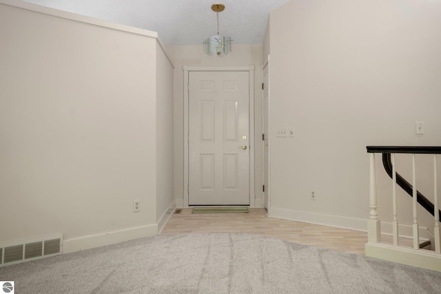 1631 Melody Ln, Interlochen, MI 49643 - foyer entrance featuring baseboards and light wood finished floors