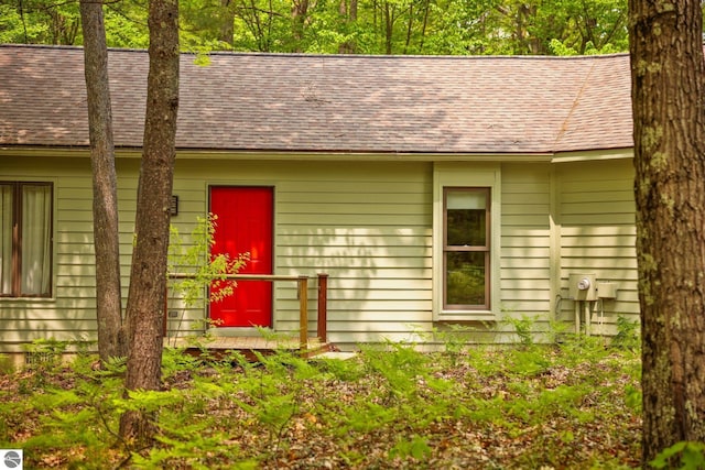 1631 Melody Ln, Interlochen, MI 49643 - view of front of house with a shingled roof