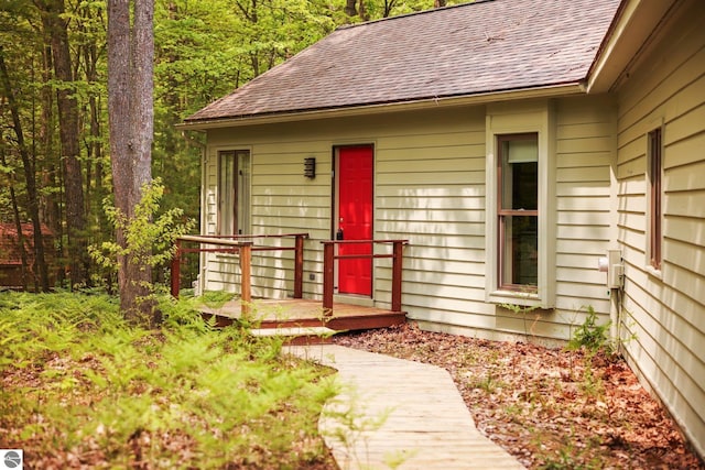 1631 Melody Ln, Interlochen, MI 49643 - property entrance featuring a shingled roof