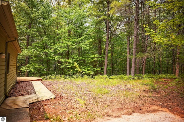 1631 Melody Ln, Interlochen, MI 49643 - view of yard with a forest view