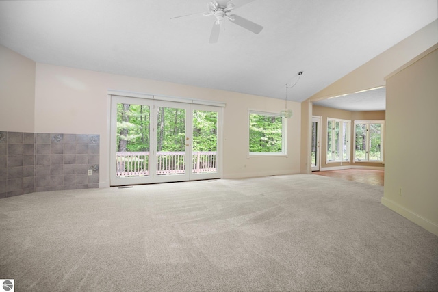 1631 Melody Ln, Interlochen, MI 49643 - empty room with lofted ceiling, carpet floors, and ceiling fan