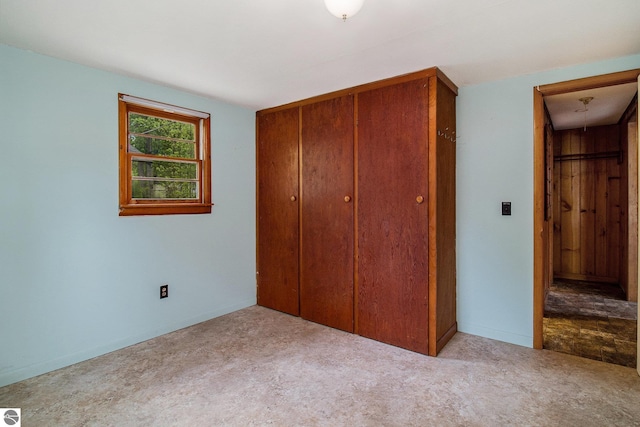 3131 Herron Rd, Frankfort, MI 49635 - unfurnished bedroom featuring a closet and carpet flooring