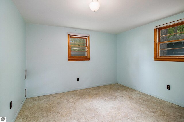 3131 Herron Rd, Frankfort, MI 49635 - carpeted spare room featuring plenty of natural light and baseboards