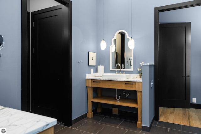 9371 Onominese Trl, Northport, MI 49670 - bathroom featuring vanity, tile patterned floors, and baseboards