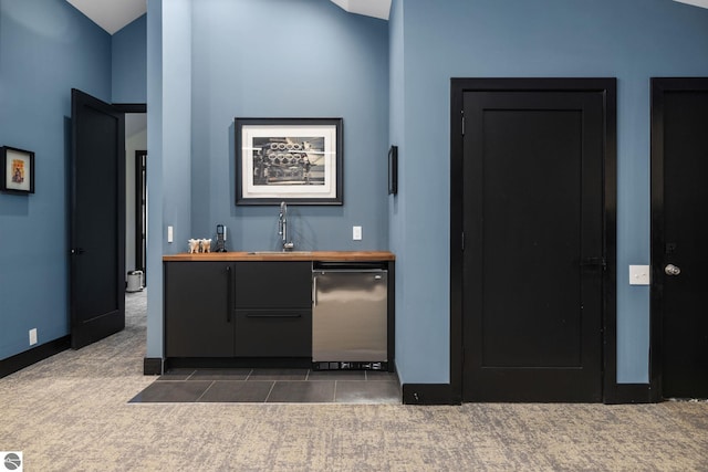 9371 Onominese Trl, Northport, MI 49670 - bar area with fridge, a sink, dark colored carpet, and baseboards