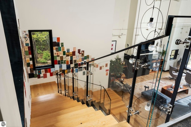 9371 Onominese Trl, Northport, MI 49670 - staircase featuring wood finished floors