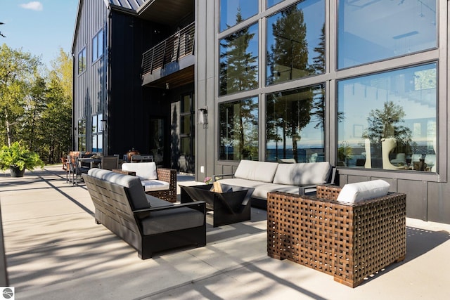 9371 Onominese Trl, Northport, MI 49670 - view of patio / terrace with outdoor lounge area and a balcony