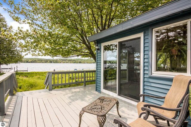 3802 S Grants Lndg, Lake Leelanau, MI 49653 - wooden deck with a water view