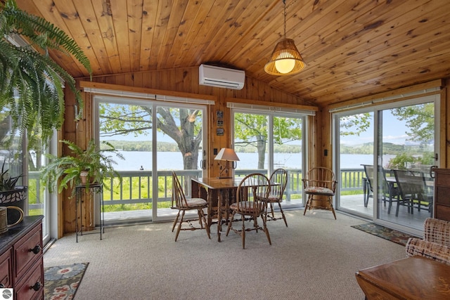 3802 S Grants Lndg, Lake Leelanau, MI 49653 - sunroom / solarium with a wall mounted air conditioner, lofted ceiling, a water view, carpet, and wooden walls