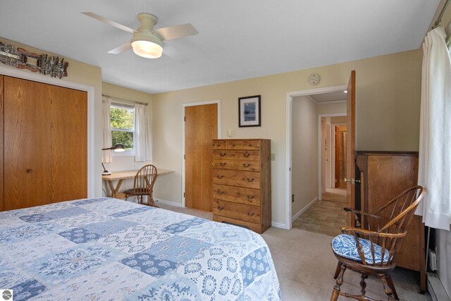 3802 S Grants Lndg, Lake Leelanau, MI 49653 - bedroom featuring carpet floors, baseboards, a ceiling fan, and a closet