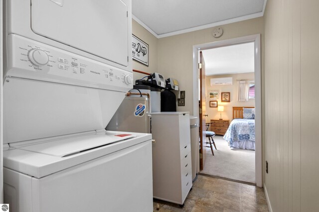 3802 S Grants Lndg, Lake Leelanau, MI 49653 - laundry area with estacked washer and dryer, a wall unit AC, and ornamental molding