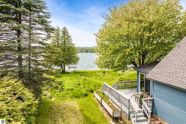 3802 S Grants Lndg, Lake Leelanau, MI 49653 - view of yard featuring a deck with water view
