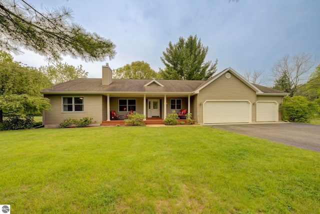10247 Fishers Run, Traverse City, MI 49685 - ranch-style home featuring covered porch, an attached garage, a chimney, asphalt driveway, and a front yard