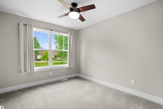 9207 Mockingbird Ln, Cadillac, MI 49601 - unfurnished room with ceiling fan, carpet, and baseboards