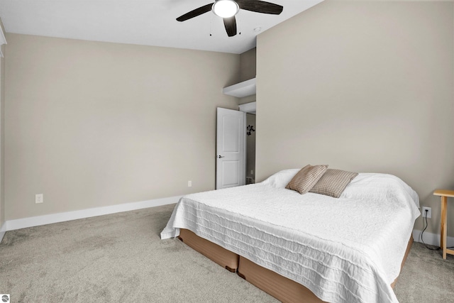 9207 Mockingbird Ln, Cadillac, MI 49601 - carpeted bedroom with baseboards and ceiling fan