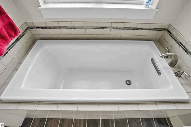 9207 Mockingbird Ln, Cadillac, MI 49601 - bathroom featuring a tub to relax in