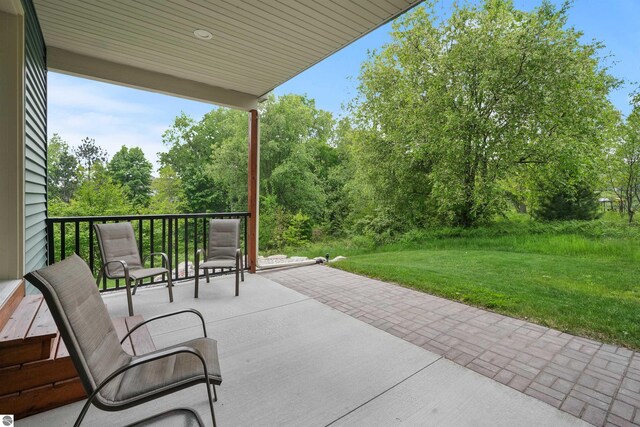 9207 Mockingbird Ln, Cadillac, MI 49601 - view of patio / terrace featuring view of scattered trees