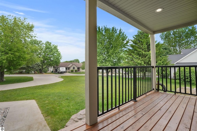 9207 Mockingbird Ln, Cadillac, MI 49601 - wooden terrace with a yard