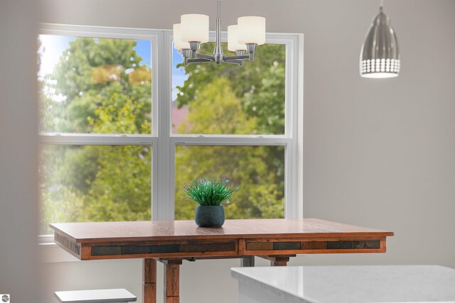 9207 Mockingbird Ln, Cadillac, MI 49601 - dining area featuring a chandelier