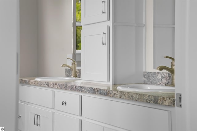 9207 Mockingbird Ln, Cadillac, MI 49601 - bathroom featuring double vanity