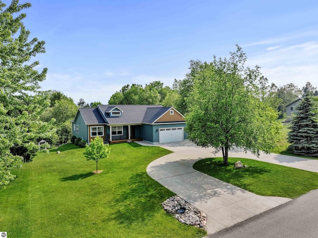 9207 Mockingbird Ln, Cadillac, MI 49601 - view of front of house with curved driveway, a front yard, and an attached garage