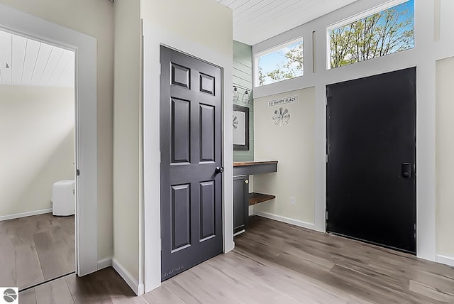 100 Fence Row Cir, Leroy, MI 49655 - foyer entrance with wood finished floors and baseboards