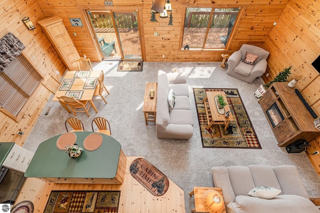 1715 Sunrise Dr, Greenbush, MI 48738 - living area featuring carpet floors and wooden walls