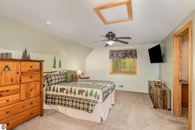 1715 Sunrise Dr, Greenbush, MI 48738 - bedroom with light colored carpet, vaulted ceiling, and ceiling fan