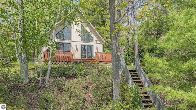 1715 Sunrise Dr, Greenbush, MI 48738 - rear view of house with a wooden deck and stairs