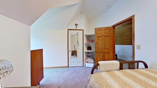 9755 E Deerfield Rd, Shepherd, MI 48883 - carpeted bedroom featuring lofted ceiling and baseboards