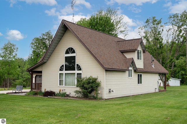 9755 E Deerfield Rd, Shepherd, MI 48883 - view of home's exterior featuring roof with shingles and a yard