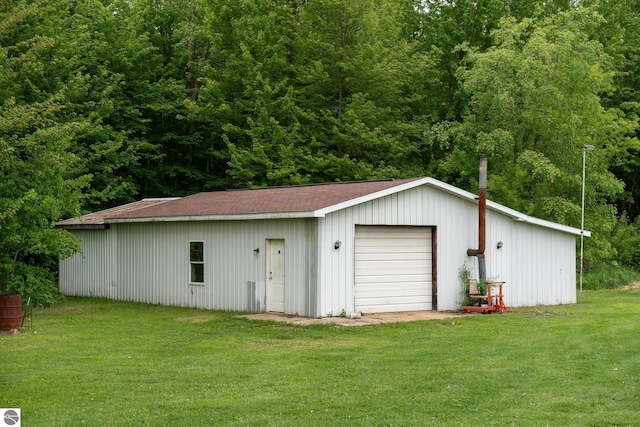 9755 E Deerfield Rd, Shepherd, MI 48883 - detached garage featuring a forest view
