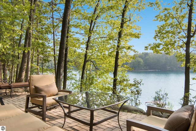 2664 Chandler Rd, Traverse City, MI 49686 - wooden terrace featuring a water view and a view of trees