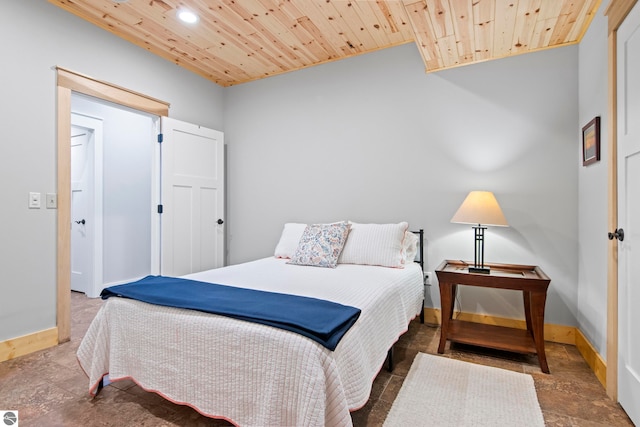2664 Chandler Rd, Traverse City, MI 49686 - bedroom with wooden ceiling, recessed lighting, baseboards, and stone finish flooring