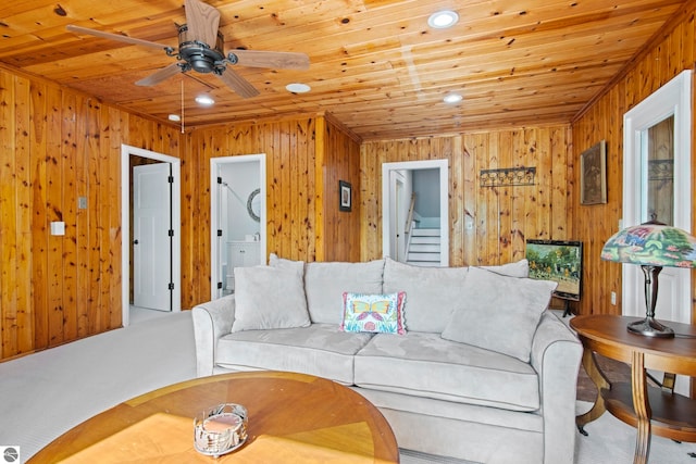 2664 Chandler Rd, Traverse City, MI 49686 - living room with wood ceiling, wood walls, a ceiling fan, and recessed lighting