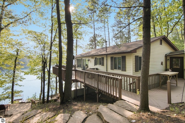 2664 Chandler Rd, Traverse City, MI 49686 - back of property with a wooden deck and a shingled roof