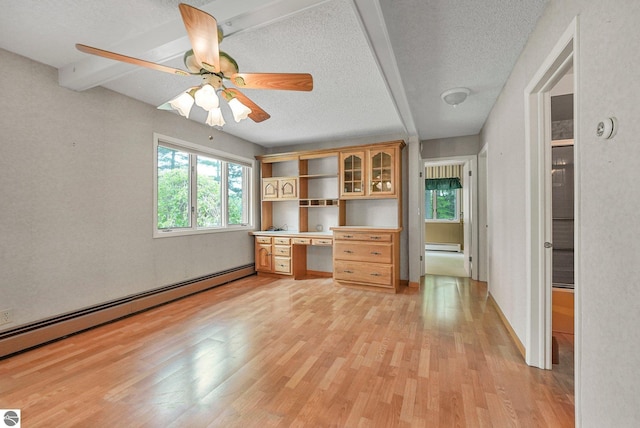 9017 Clam Lake Rd, Bellaire, MI 49615 - unfurnished office with baseboard heating, a baseboard radiator, light wood-style flooring, a textured ceiling, and ceiling fan
