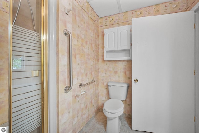 9017 Clam Lake Rd, Bellaire, MI 49615 - bathroom featuring toilet and tile patterned floors