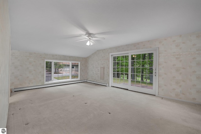 9017 Clam Lake Rd, Bellaire, MI 49615 - spare room featuring ceiling fan, carpet floors, healthy amount of natural light, wallpapered walls, and lofted ceiling