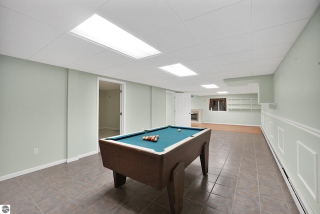 9017 Clam Lake Rd, Bellaire, MI 49615 - game room featuring billiards table, a paneled ceiling, tile patterned flooring, and a baseboard heating unit