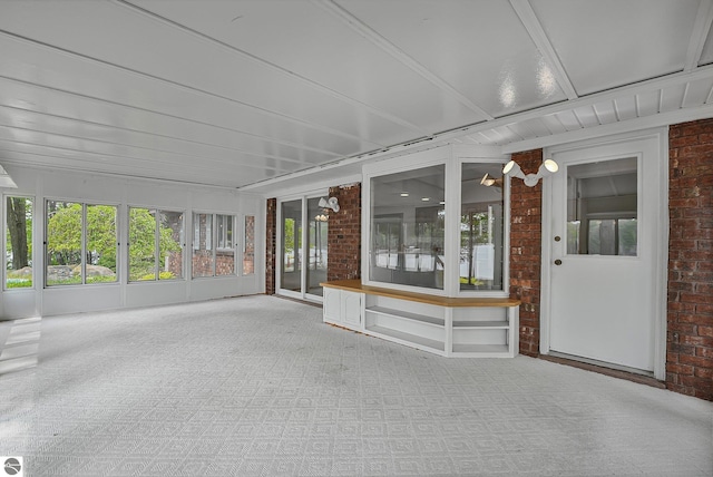 9017 Clam Lake Rd, Bellaire, MI 49615 - unfurnished sunroom featuring healthy amount of natural light and french doors