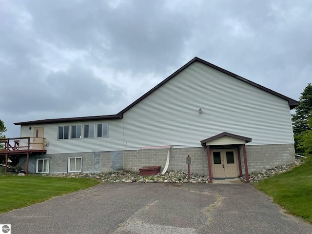 8055 S Castle Dr, Sheridan, MI 48884 - view of property exterior with a yard and a deck