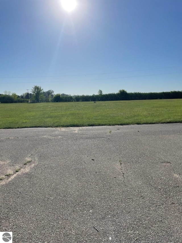 8055 S Castle Dr, Sheridan, MI 48884 - view of asphalt street with a rural view