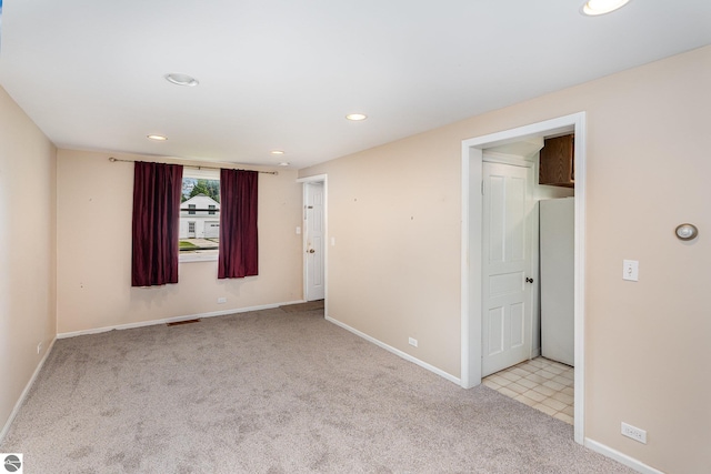 212 Palmer St, Mount Pleasant, MI 48858 - carpeted empty room featuring recessed lighting and baseboards