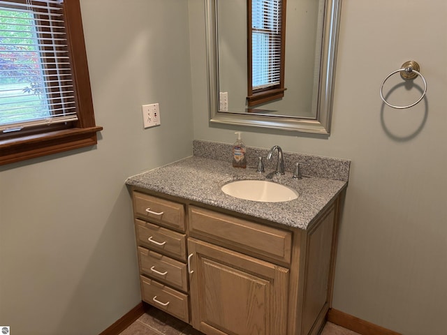 5867 Huron Woods Dr, Tawas City, MI 48763 - bathroom with vanity and baseboards