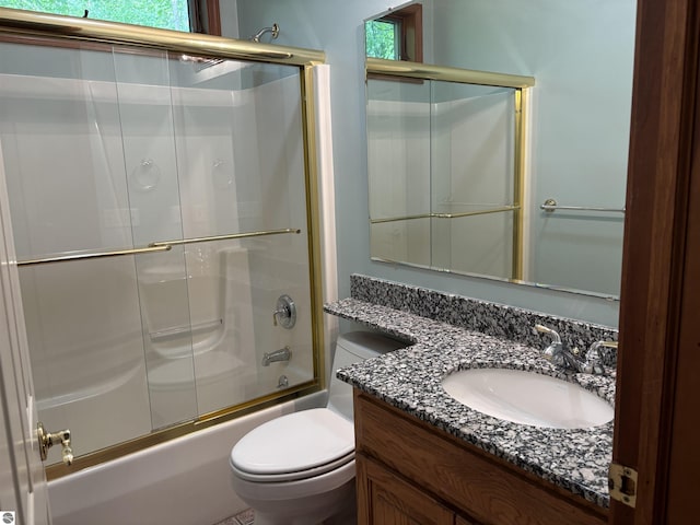 5867 Huron Woods Dr, Tawas City, MI 48763 - bathroom with toilet, vanity, and combined bath / shower with glass door