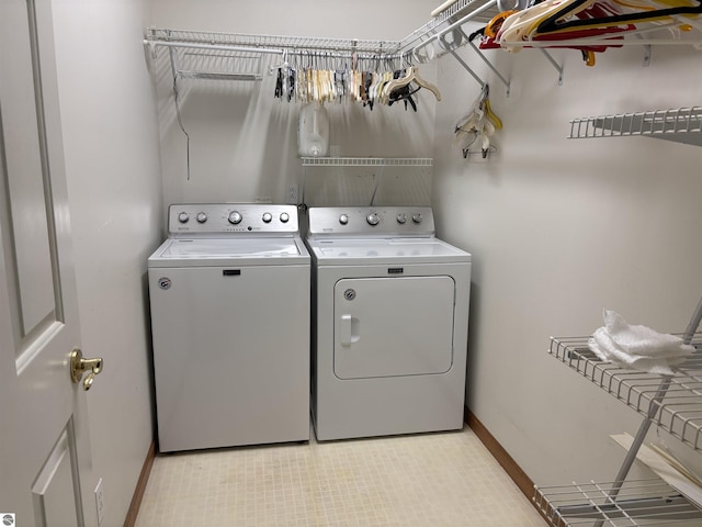 5867 Huron Woods Dr, Tawas City, MI 48763 - washroom with independent washer and dryer and baseboards