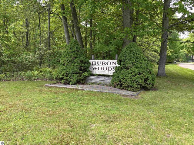 5867 Huron Woods Dr, Tawas City, MI 48763 - community sign featuring a lawn