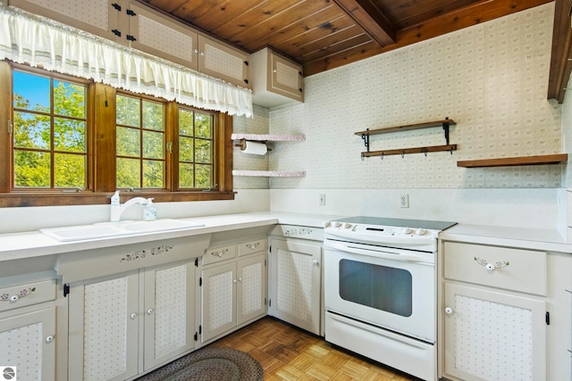 12570 N Cathead Point Rd, Northport, MI 49670 - kitchen featuring white electric range, light countertops, a sink, wooden ceiling with exposed beams, and open shelves
