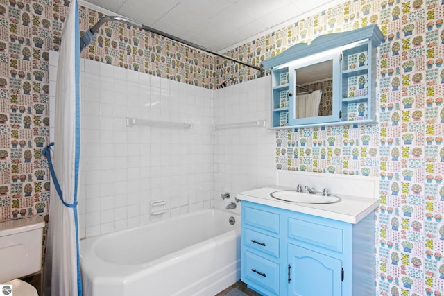 12570 N Cathead Point Rd, Northport, MI 49670 - full bath with shower / bath combo with shower curtain, vanity, wallpapered walls, and toilet